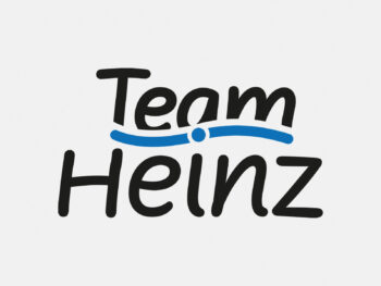 Logo Team Heinz in Farbe auf grauem Hintergrund